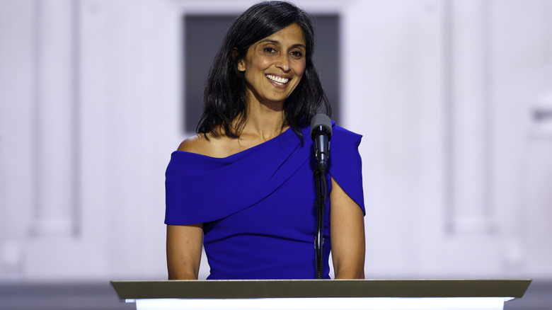 Usha Vance smiling in blue at a podium