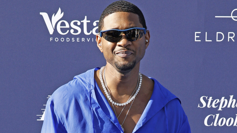 Usher wearing blue