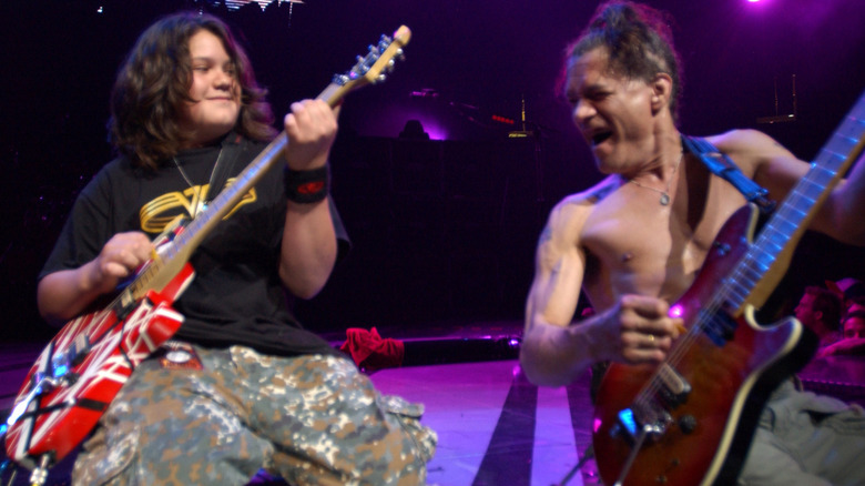 Eddie and Wolfgang Van Halen performing on stage