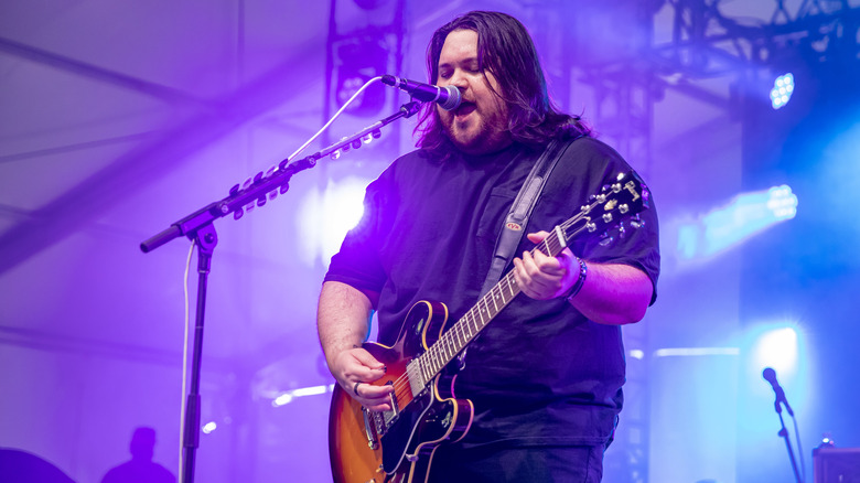 Wolfgang Van Halen singing and playing on stage