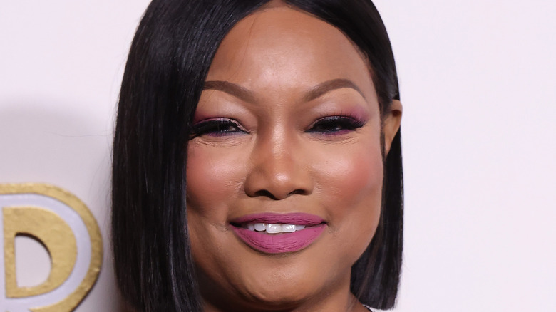 Garcelle Beauvais posing in pink lipstick