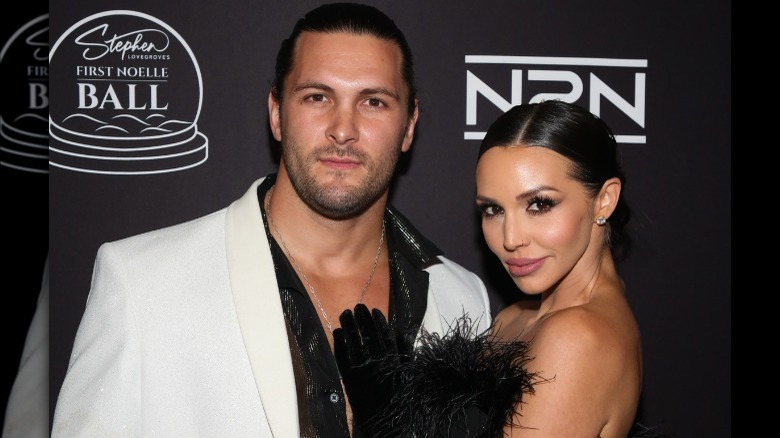 Scheana Shay holding Brock Davies' chest