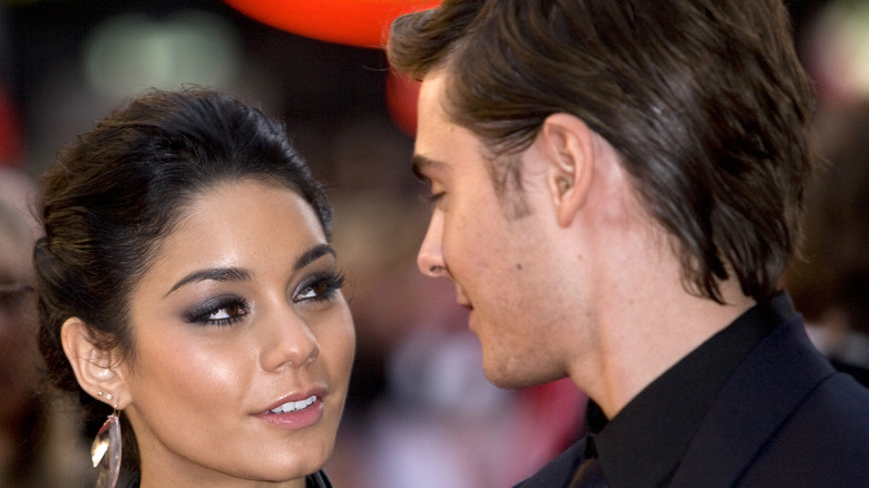 Vanessa Hudgens and Zac Efron posing  