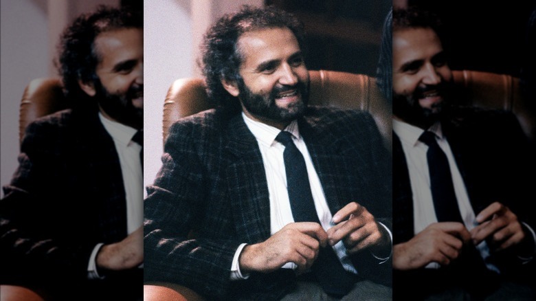 Gianni Versace sitting in Italy