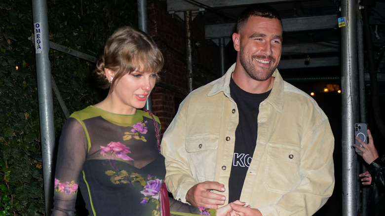 Taylor Swift and Travis Kelce walking