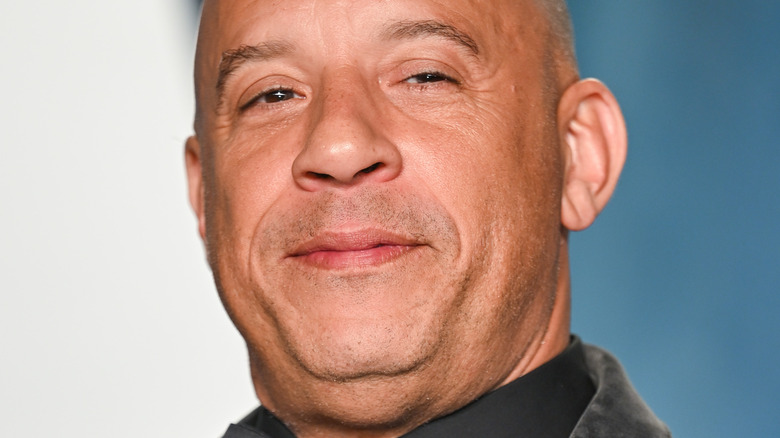 Vin Diesel poses in a black suit