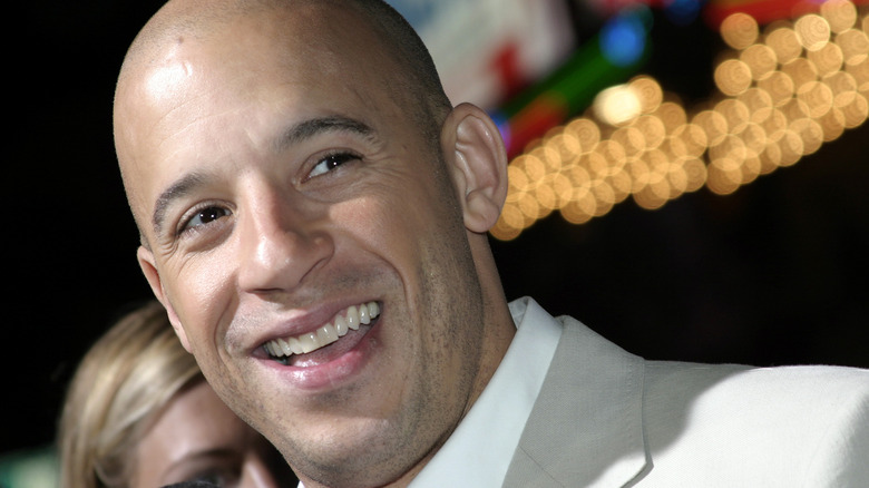 Vin Diesel smiling at a film premiere