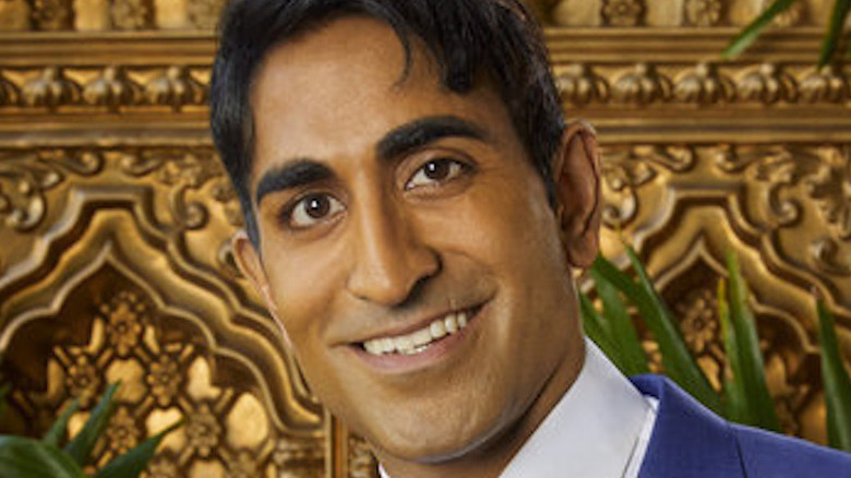 Vishal Parvani smiling on a couch