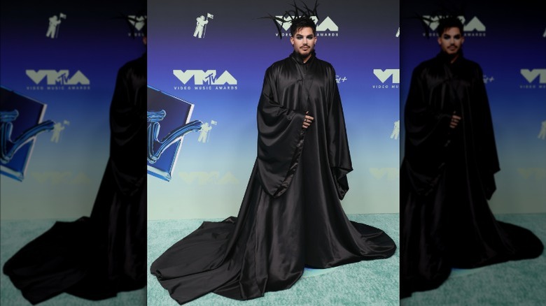 Adam Lambert wearing a long black robe