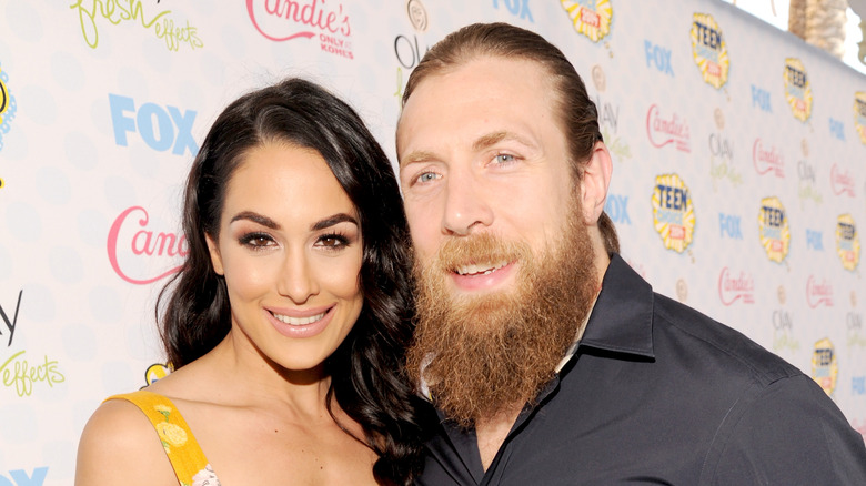 Brie Bella poses with Bryan Danielson on red carpet