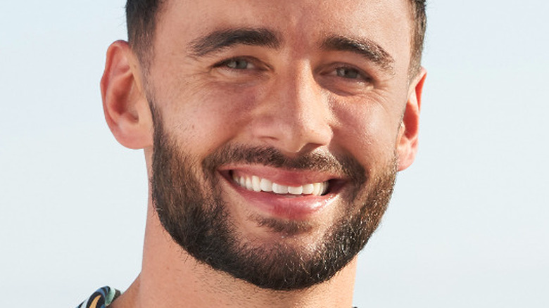 Brendan Morais smiling on the beach