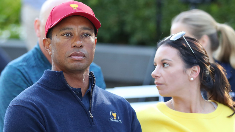 Tiger Woods and Erica Herman posing