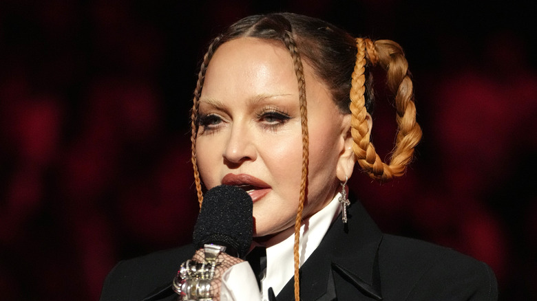 Madona holding a mic