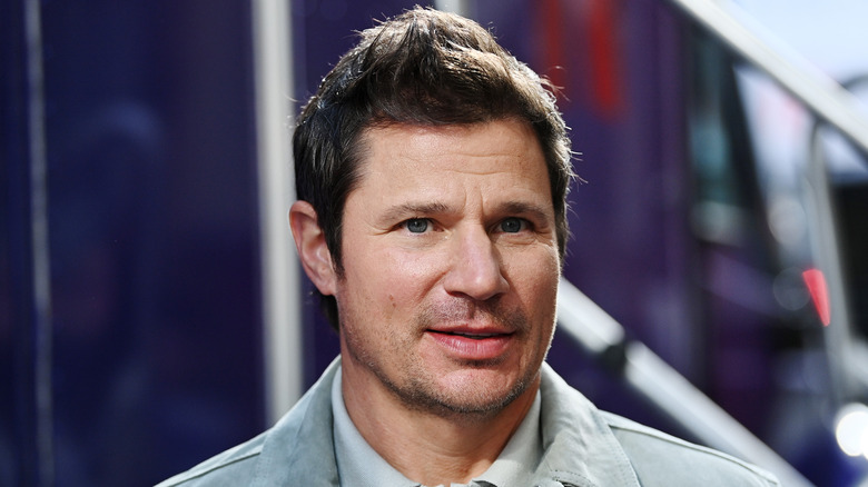 Nick Lachey wears a gray jacket