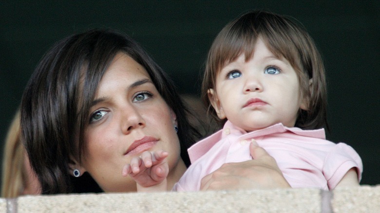 Katie Holmes holds baby Suri