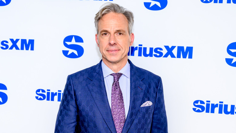 Jake Tapper posing on the red carpet.