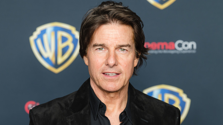 Tom Cruise posing at CinemaCon.