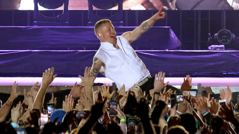 Macklemore being carried by the crowd at Recovery Fest in 2018
