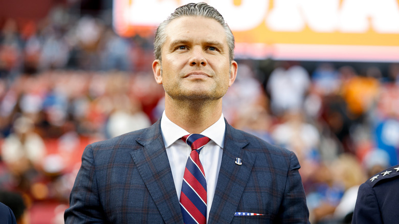 Pete Hegseth pictured gazing skyward.