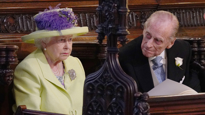 Prince Philip looking at Queen Elizabeth.