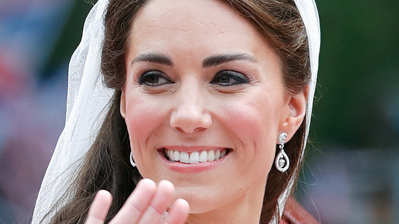 Kate Middleton smiling and waving