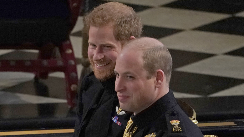 Prince Harry grinning with Prince William