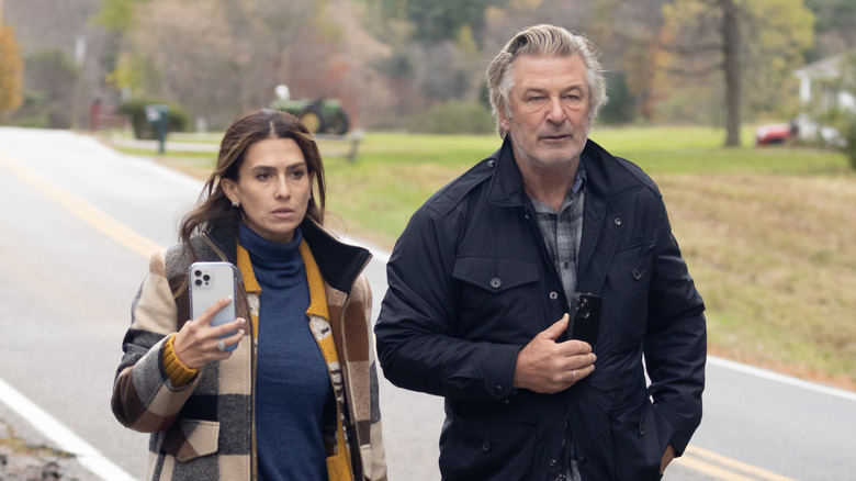 Hilaria and Alec Baldwin walking down a country road