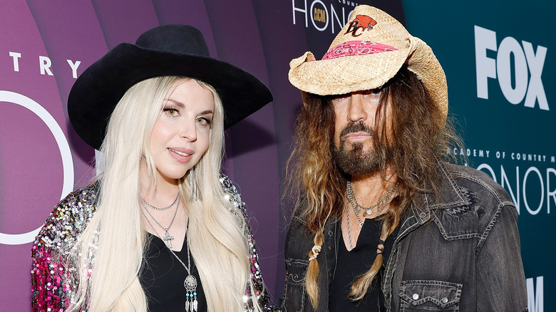 Billy Ray Cyrus and Firerose wearing hats