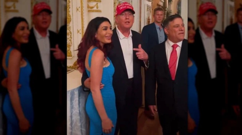 Donald Trump holding Laura Loomer's waist