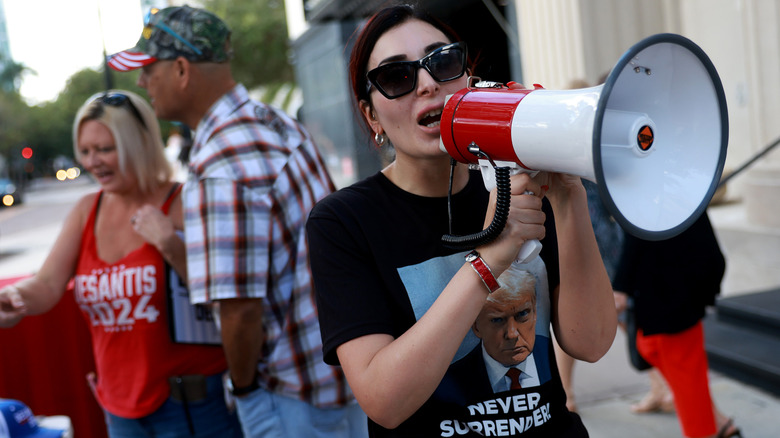 Laura Loomer holding a megaphone at a DeSantis event