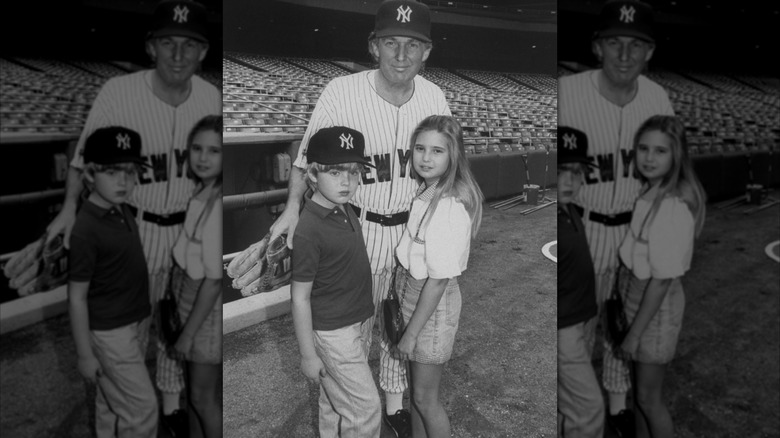 Donald Trump wearing baseball uniform and posing with young Eric and Ivanka Trump