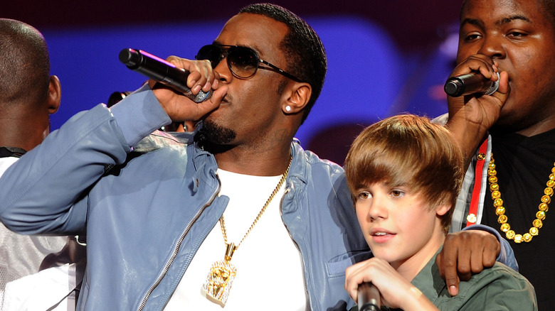 Diddy with arm around Justin Bieber