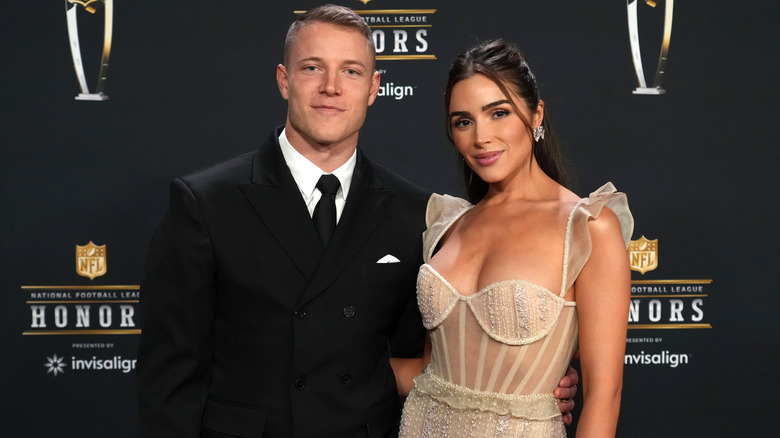 Olivia Culpo Christian McCaffrey posing