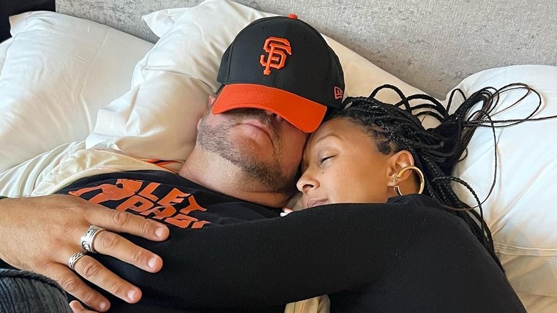 Tamera Mowry and Adam Housely lying in bed