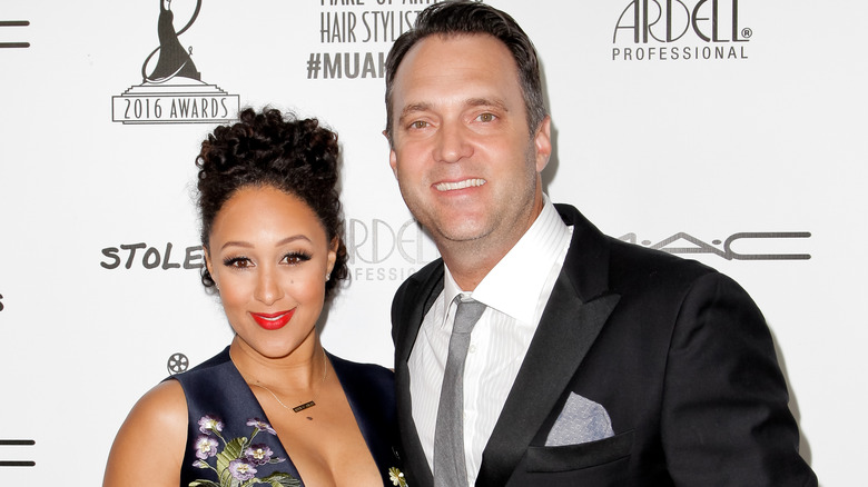 Tamera Mowry and Adam Housley posing