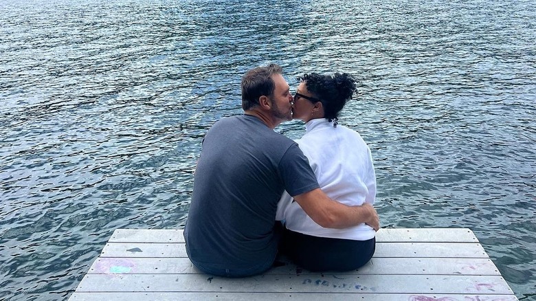 Tamera Mowry and Adam Housley kissing