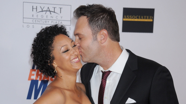 Adam Housely kisses Tamera Mowry on the cheek