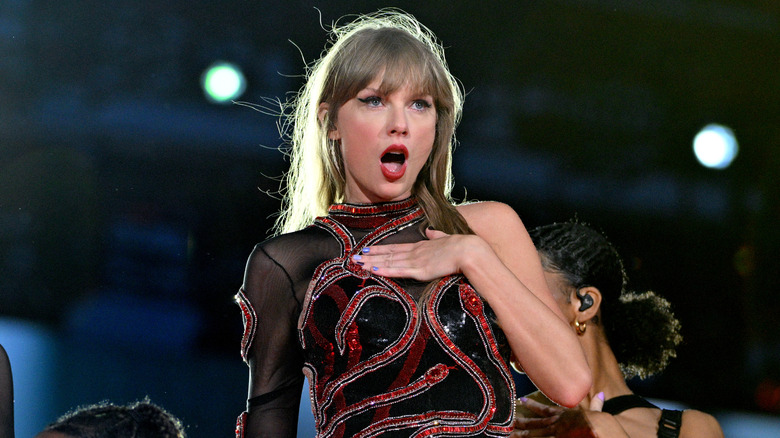 Taylor Swift with hand on chest