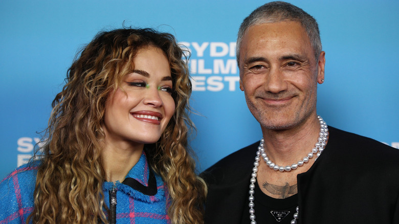 Rita Ora smiling at Taika Waititi
