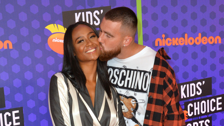 Travis Kelce kisses Kayla Nicole at the Kids' Choice Awards