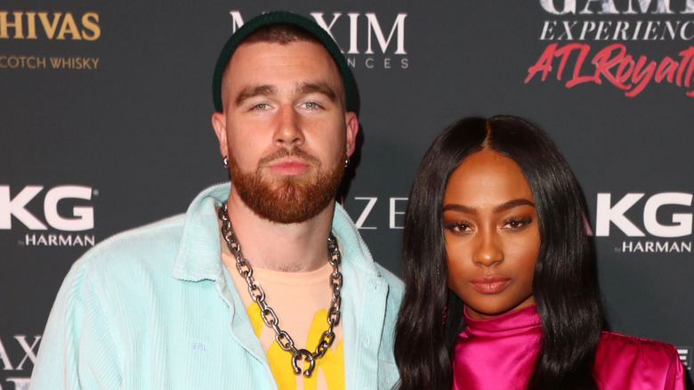 Travis Kelce and Kayla Nicole pose for a photo