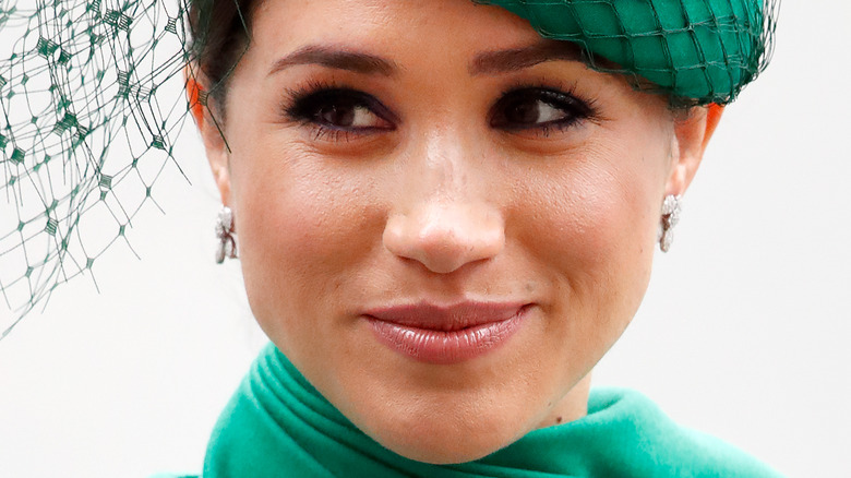 Meghan Markle smirking