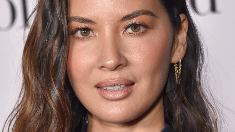 Olivia Munn wears an all-blue outfit at a movie premiere
