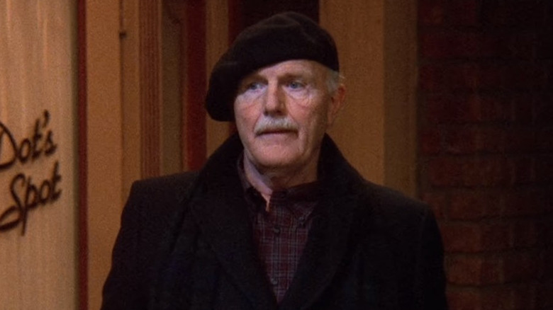 Richard Roat as Burt walking on street