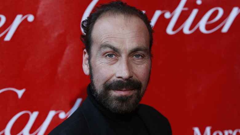Taylor Negron raising one eyebrow in a close up