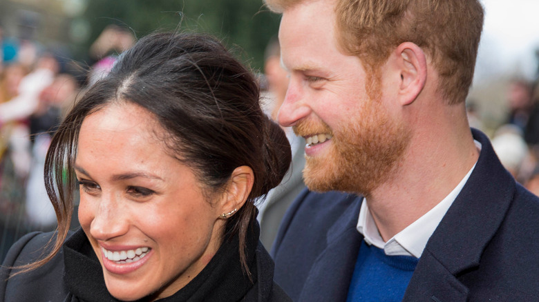 Prince Harry and Meghan Markle smiling