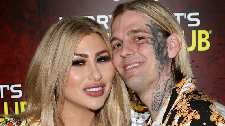 Aaron Carter and Melanie Martin smile