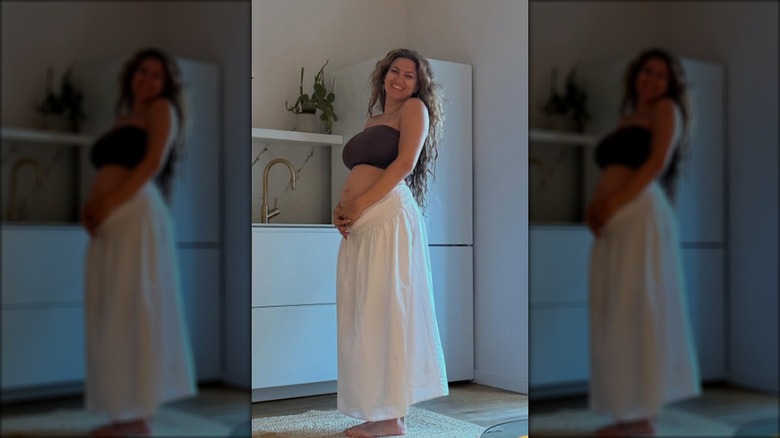 Tori Kelly showcasing her baby bump