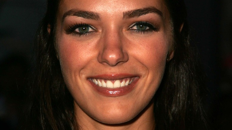 Adrianne Curry smiles at an event