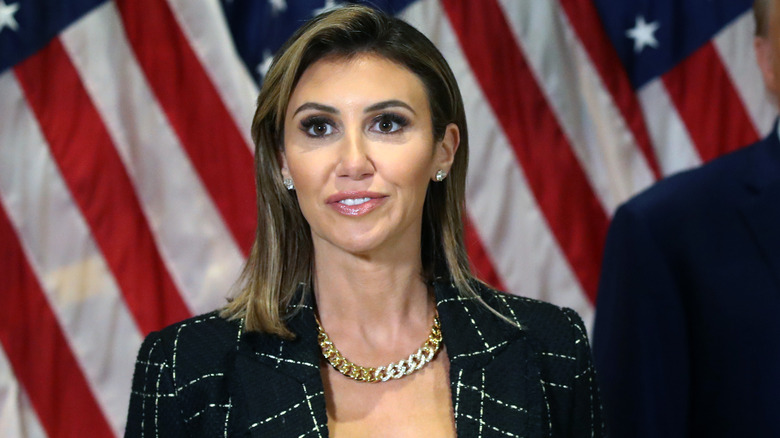 Alina Habba in front of American Flag